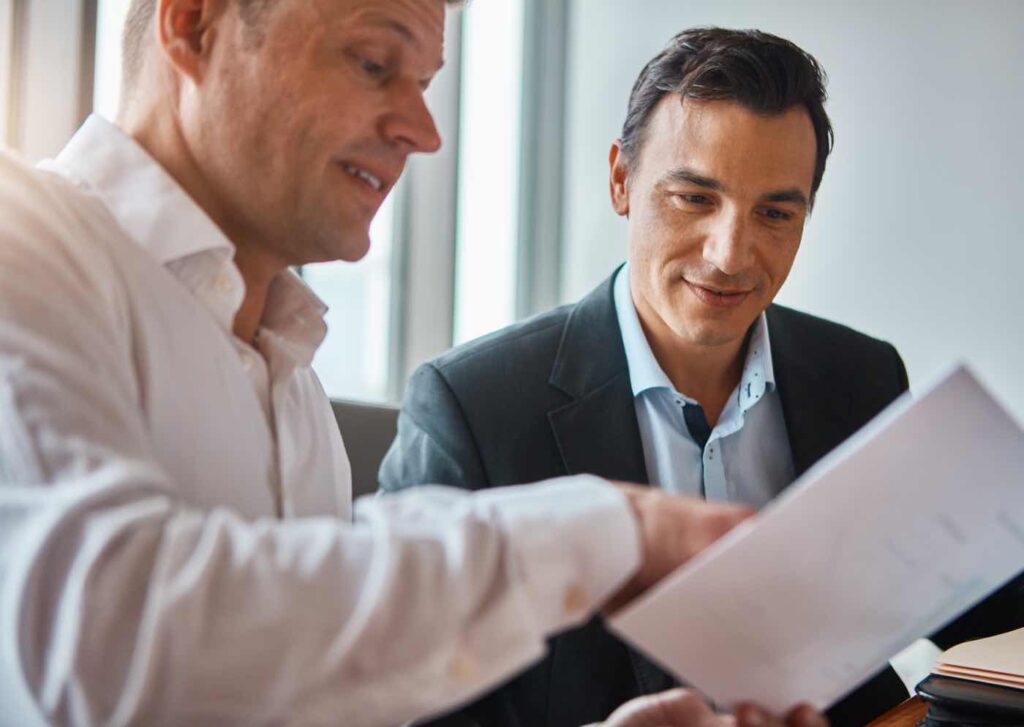 Florida insurance agent helping small business owner review quote