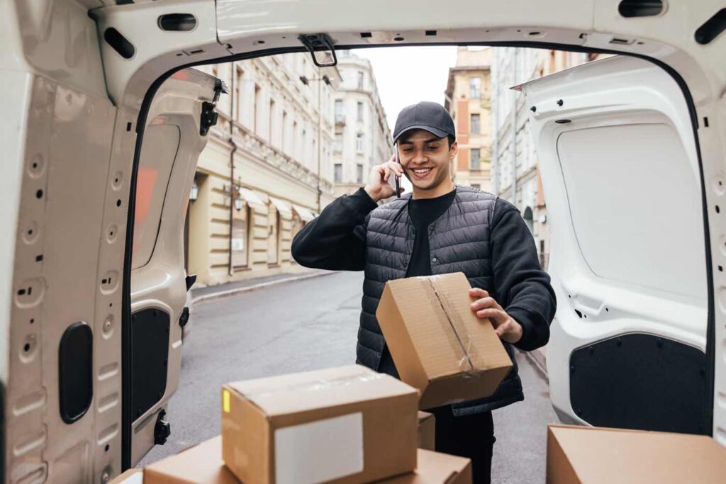 Florida delivery driver reviewing phone – commercial auto insurance coverage